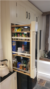 Slim larder cupboard pulled out to expose contents